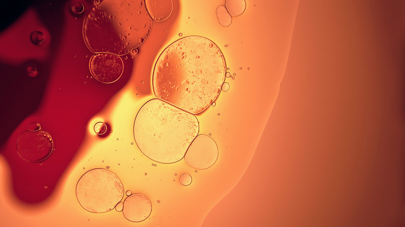 Orange and amber liquid with bubbles